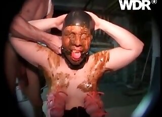 Direct pooping into the mouth of a submissive masked man