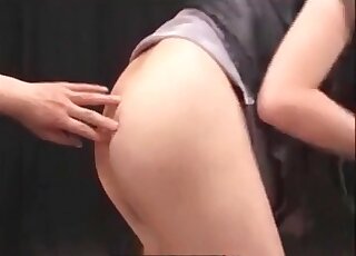 Redheaded Japanese with short hair is playing with toys