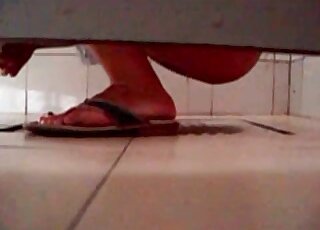 Man is filming the action in the public toilet